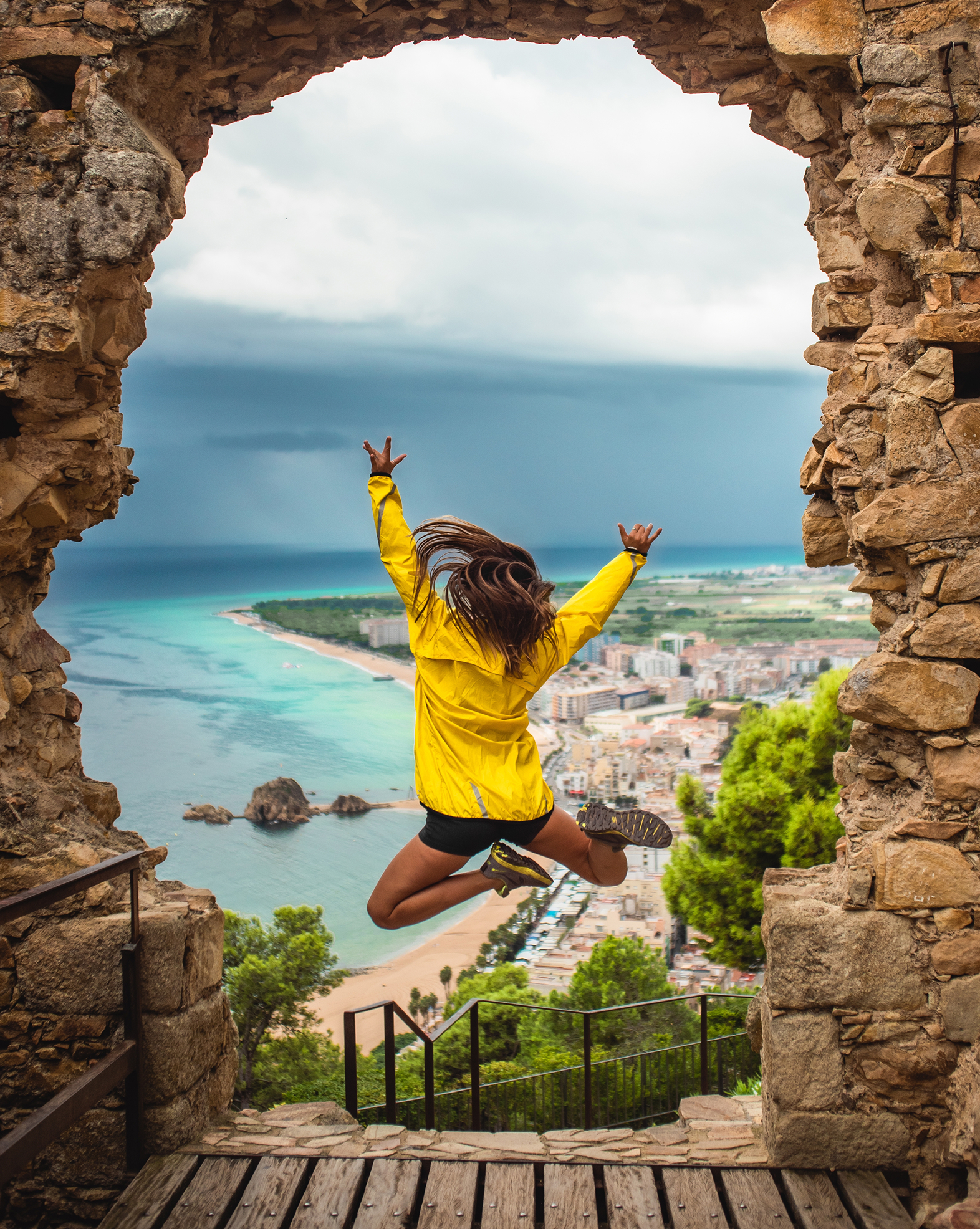 Girl Jumping With Excitement Doorway With Sea 1